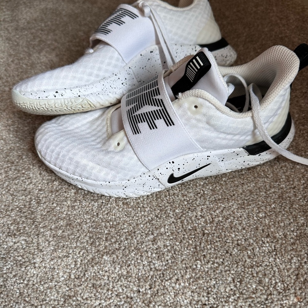 Women’s white Nike sneakers